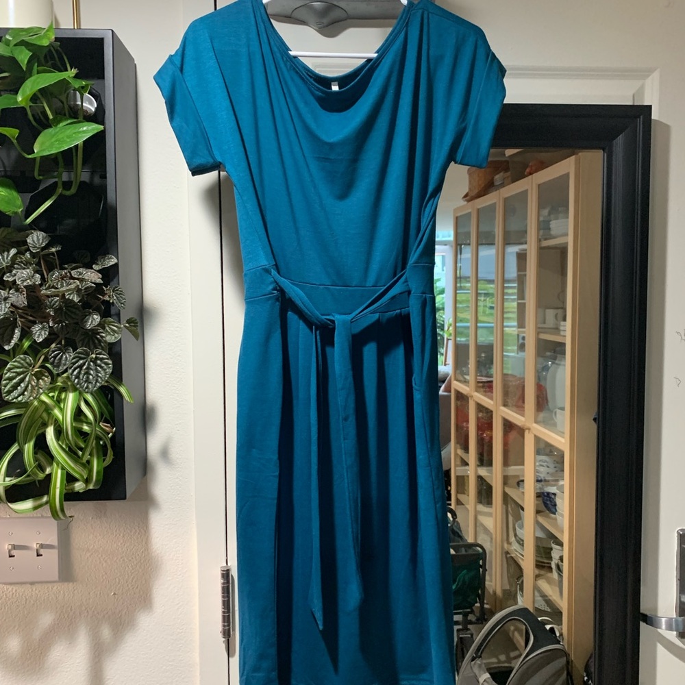 Teal dress with wrap belt.